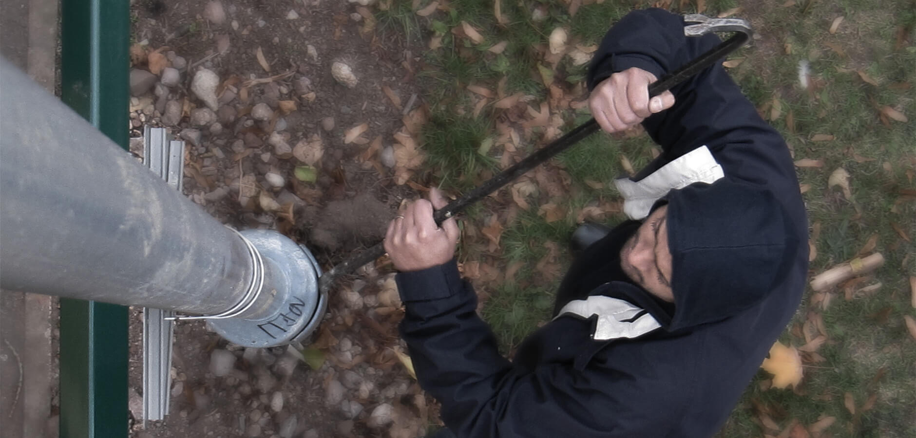 Man attempting to vandalise lamp post